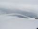 Foto von , Kategorie Flügel von innen Flug durch die Wolkendecke über der Schweiz